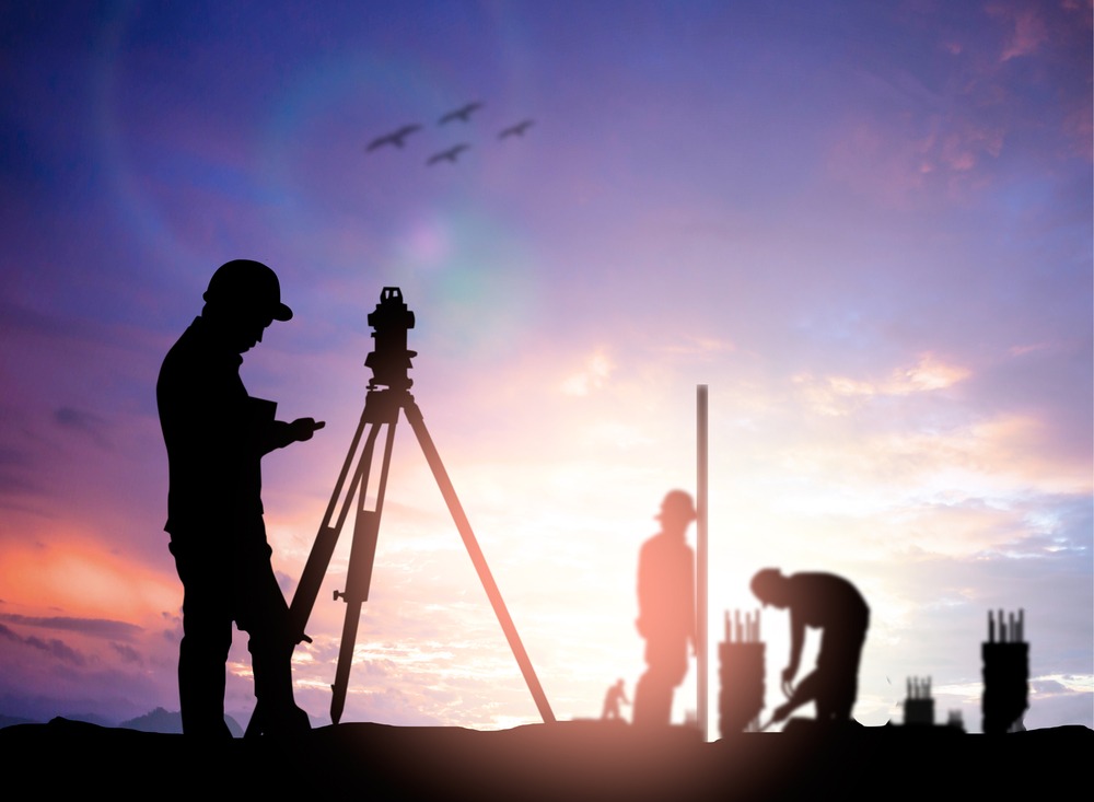 Licensed land surveyor completing a plat of survey in Danforth, Iroquois County, Illinois